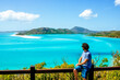 Australia, Queensland, Whitsunday Island, man looking at Whitehaven Beach
