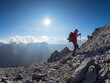 Border region Italy Switzerland, senior man hiking in mountain landscape at Piz Umbrail