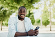 © SHOTPRIME STUDIO - Man smile mobile cellphone smartphone phone lifestyle person black male happy looking young