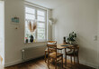 © tunedin - Modern interior of room with table and chairs by window at old house