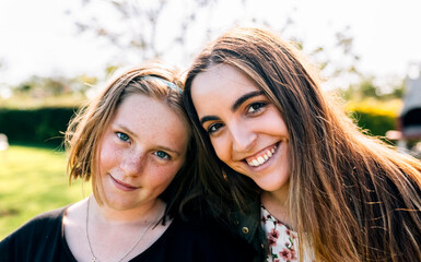 Portrait of two smiling girls outdoors