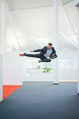 Sticker - Businessman jumping mid-air on office floor