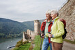 Germany, Rheingau, happy senior couple looking at view