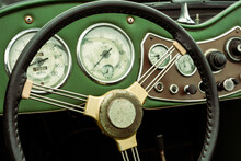 Vintage Steering Wheel And Dashboard On A Vintage Green Car