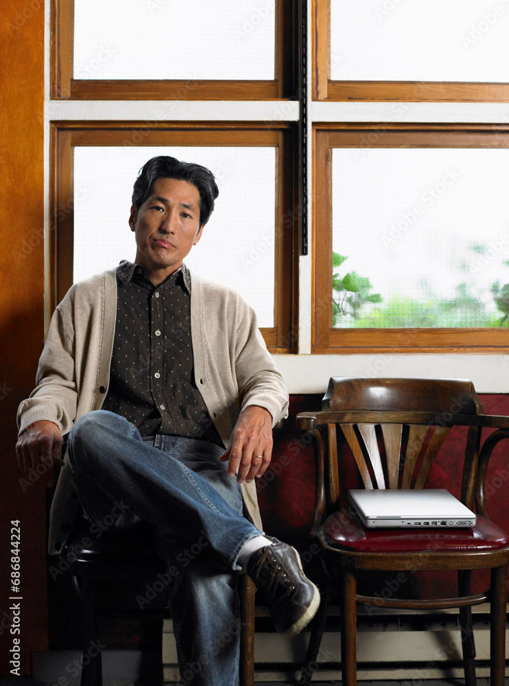 Man with Laptop Computer in Waiting Area Stock Photo | Adobe Stock