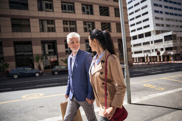 Wall Mural - Mature couple walking in the city