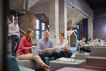 Canvas Print - Business people having a informal meeting in communications pit