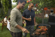 © Designpics - Men at Barbecue