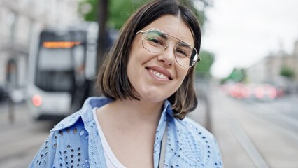 Poster - Young beautiful hispanic woman smiling confident standing in the streets of Vienna