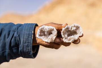 Man holding a crystal geode.