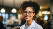 
A young and beautiful pharmacist in a white coat works in the pharmacy. They are professional and trained pharmacists or chemists providing medical care and services.