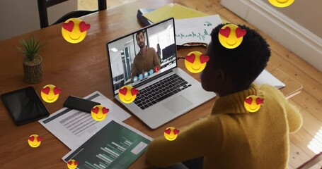 Poster - Animation of heart eyes face emojis over african american woman having video call on laptop