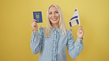 Sticker - Joyous young blonde woman confidently embracing her israeli patriotism, smiling with passport and flag on a vibrant isolated yellow background!