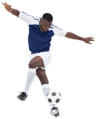 Sticker - Digital png photo of african american male soccer player kicking ball on transparent background