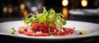 Raw beef fillet tartar served on a modern-looking plate with lettuce, tomatoes, Parmesan, and capers, ready to be enjoyed.