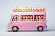 Pink mini truck fully loaded with colorful donuts. Food truck vehicle - donuts store. Delivery