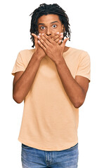 Wall Mural - Young african american man wearing casual clothes shocked covering mouth with hands for mistake. secret concept.