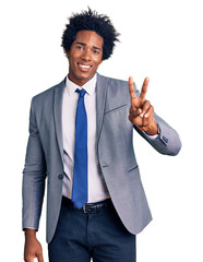 Canvas Print - Handsome african american man with afro hair wearing business jacket smiling looking to the camera showing fingers doing victory sign. number two.