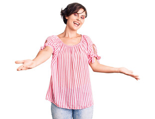 Poster - Beautiful young woman with short hair wearing casual summer clothes smiling cheerful offering hands giving assistance and acceptance.