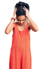 Poster - Cute african american girl wearing casual clothes suffering from headache desperate and stressed because pain and migraine. hands on head.