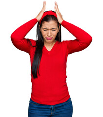 Poster - Young hispanic woman wearing casual clothes suffering from headache desperate and stressed because pain and migraine. hands on head.