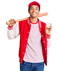 Poster - Young african amercian man playing baseball holding bat and ball looking positive and happy standing and smiling with a confident smile showing teeth