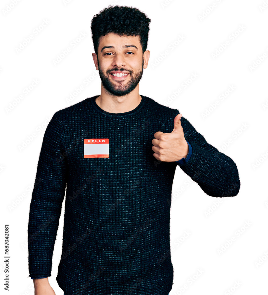 Young arab man with beard wearing hello my name is sticker ...
