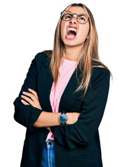 Sticker - Hispanic young woman with arms crossed gesture angry and mad screaming frustrated and furious, shouting with anger looking up.