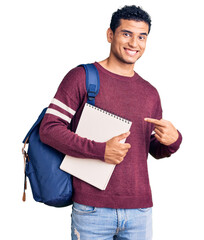 Poster - Hispanic handsome young man wearing student backpack and notebook smiling happy pointing with hand and finger