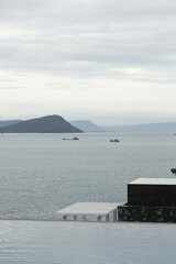 Canvas Print - Outdoor swimming pool overlooking the sea