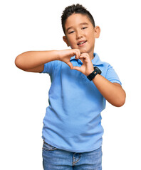 Sticker - Little boy hispanic kid wearing casual clothes smiling in love doing heart symbol shape with hands. romantic concept.