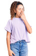 © Krakenimages.com - Beautiful kid girl with curly hair wearing casual clothes bored yawning tired covering mouth with hand. restless and sleepiness.