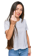 Canvas Print - Young hispanic girl wearing casual white t shirt showing middle finger, impolite and rude fuck off expression