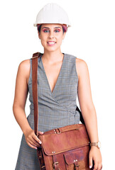 Sticker - Young beautiful woman wearing architect hardhat and leather bag looking positive and happy standing and smiling with a confident smile showing teeth