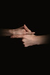 © Юрий Горид - human hands with anime gestures on a black background