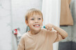© inna717 - Little boy brushing his teeth in the bathroom at home