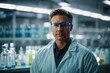 © liliyabatyrova - A close-up portrait of a male microbiologist, laboratory assistant, pharmacist, scientist against the background of a modern laboratory.