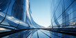 Modern architectural elegance: Upward view of a futuristic skyscraper's curved glass facade reflecting the clear blue sky