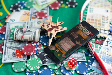 Wall Mural - gamble. Poker concept.playing cards, chips and dollars are scattered around the new poker table.