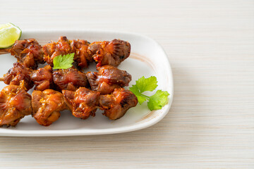 Wall Mural - grilled chicken gizzard skewer with herbs and spices