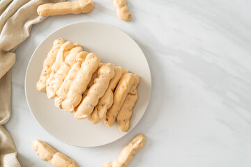 Canvas Print - almonds meringue stick on plate