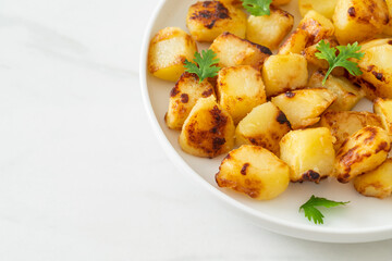 Wall Mural - Roasted or grilled potatoes  on plate