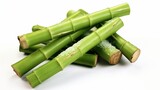 Fototapeta Sypialnia - Fresh green Sugarcane trunks tied with green leaf and peeled isolated on white background, Natural organic sugar cane