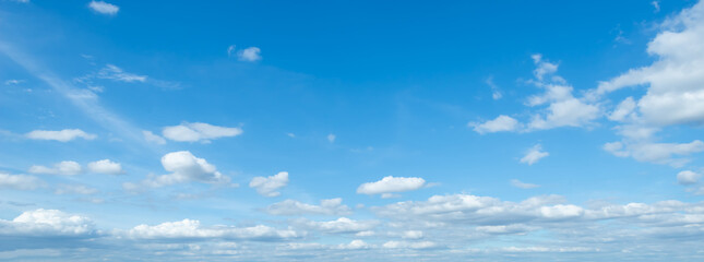 Wall Mural - summer blue clouds. gradient light white background . Beautiful clouds in the sunlight. The winter weather is calm and bright.panorama.