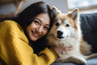 Woman hugging dog, happy and smiling