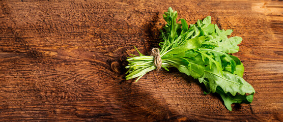 Wall Mural - Rucola on a wooden background