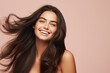 Beautiful smiling brunette woman with healthy shiny long hair