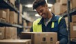 Warehouse worker scanning box while smiling at camera
