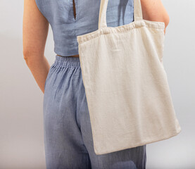 Canvas Print - Carrying textile shopper, linen tote bag, standing back view