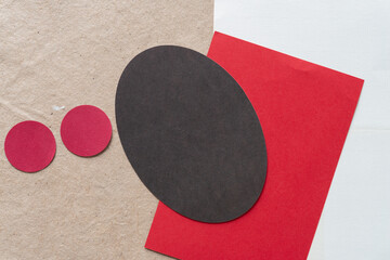 Canvas Print - two red paper circles, dark brown oval, blank red and gray cards on plain brown paper